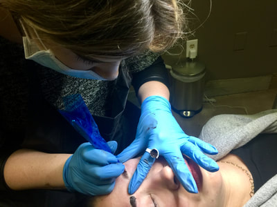 Microblading Student performing procedure during training.